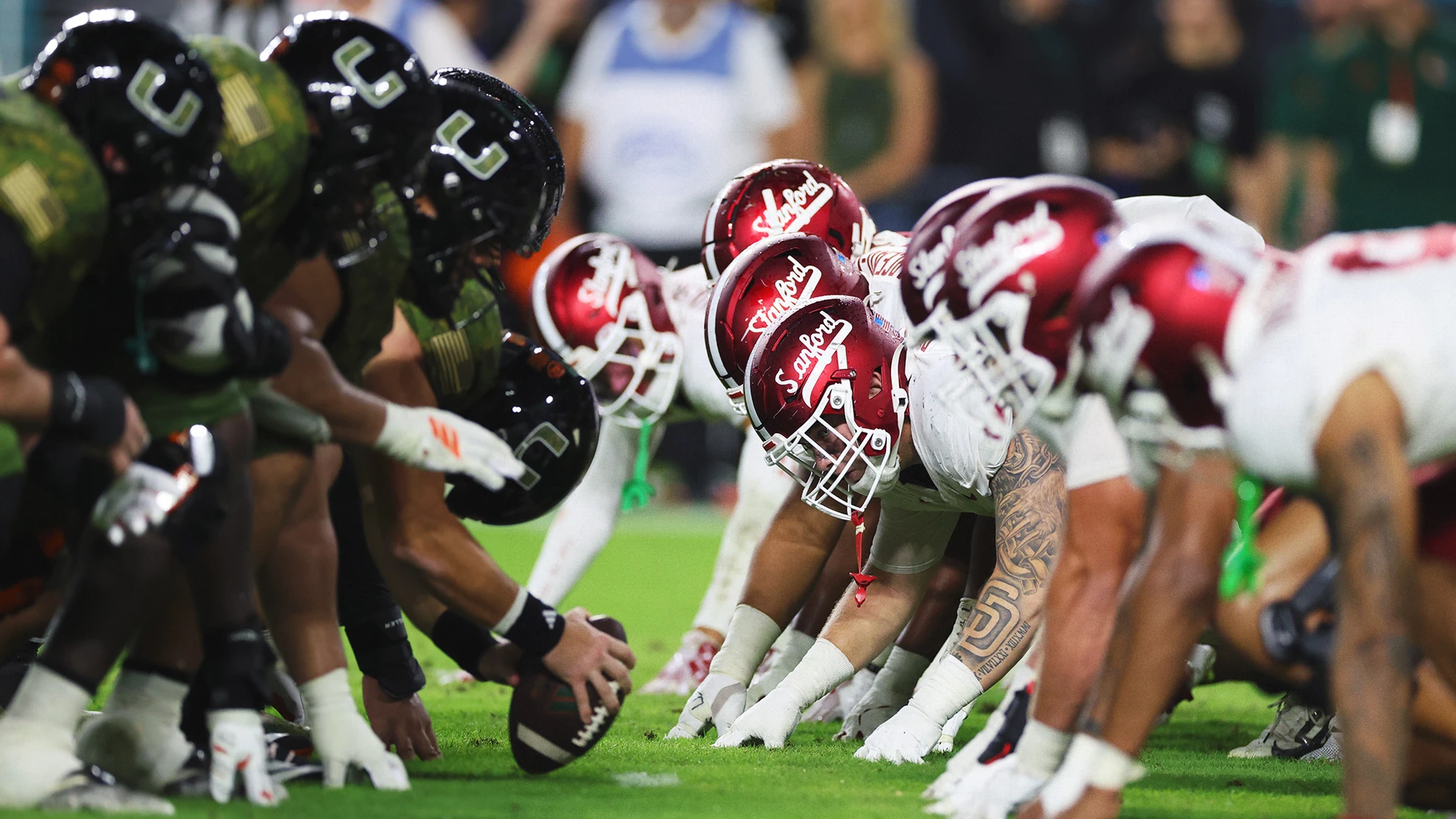 Stanford and Miami offensive lines set at the line of scrimmage