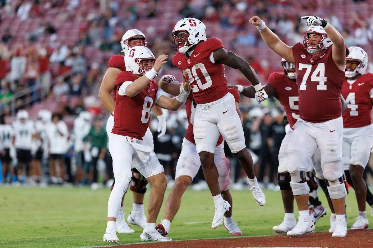 Stanford players celebrating a touchdown in the end zone at Stanford Stadium